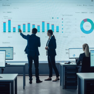 Business men have a look at data visualization in a corporate presentation.